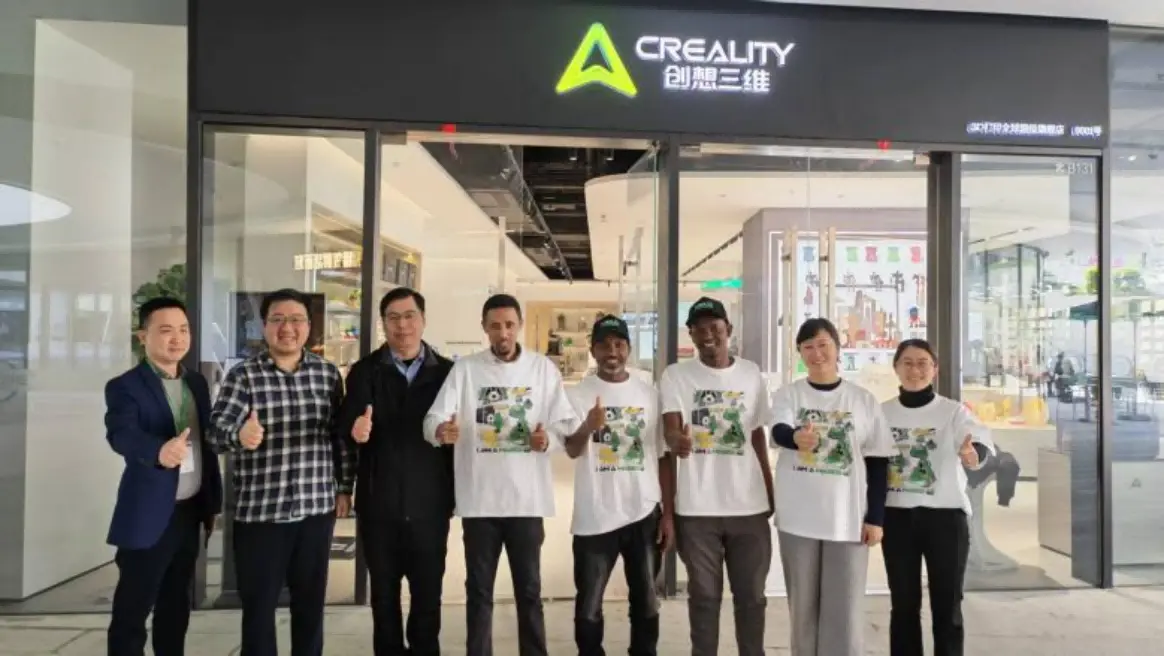 Ethiopian teachers and Chinese industry representatives pose at Creality headquarters